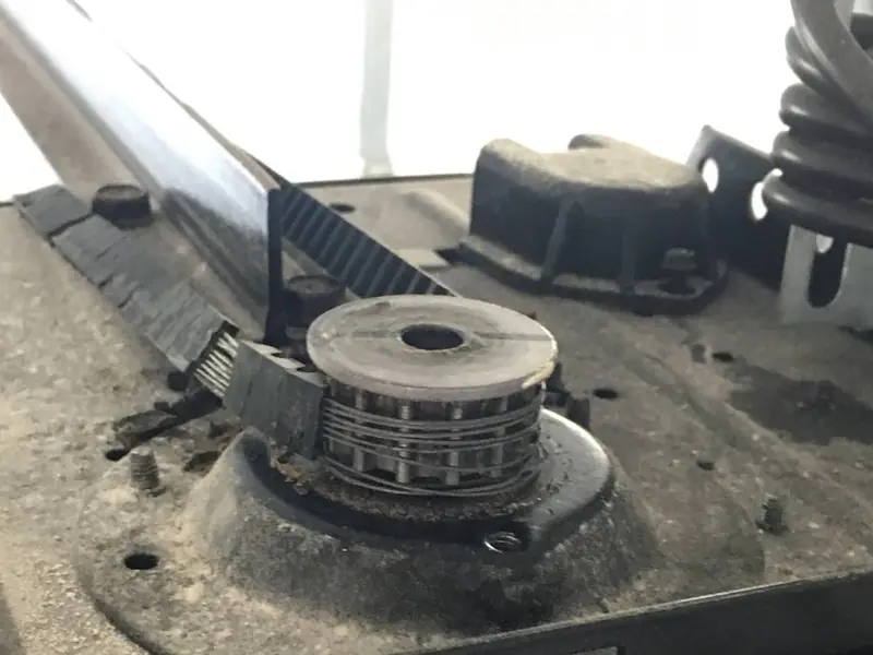 Close-up of an opener drive sprocket and belt