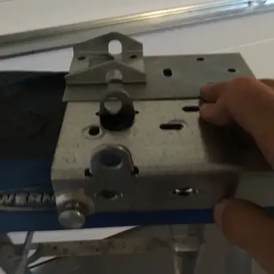 Garage door bottom bracket