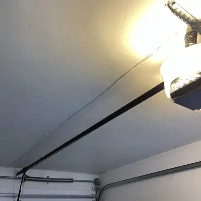 Garage door opener and rail